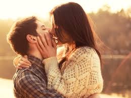 Couple embracing at sunset