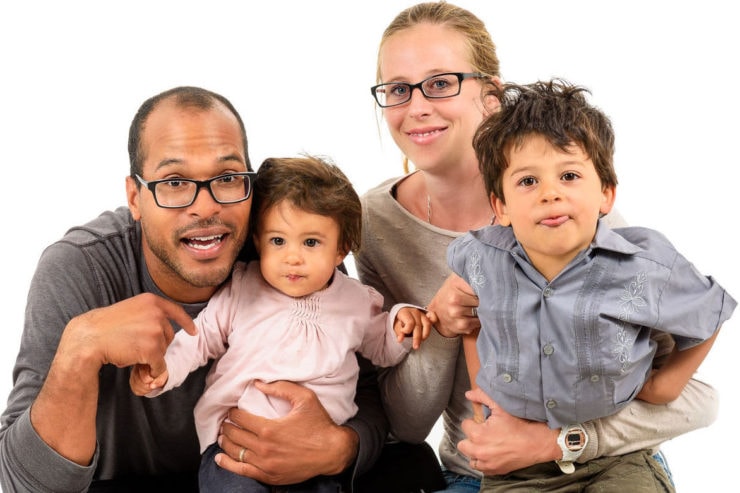 Smiling family of four